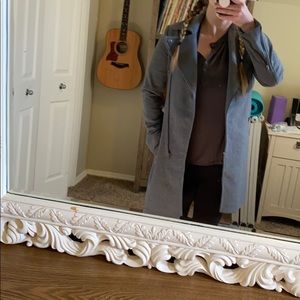 Gray coat with zipper details.